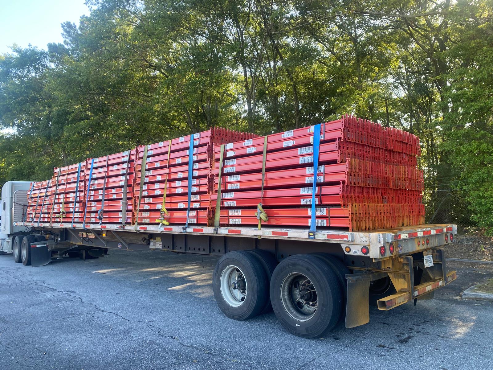 Warehouse manager reviewing equipment financing paperwork for a pallet racking order